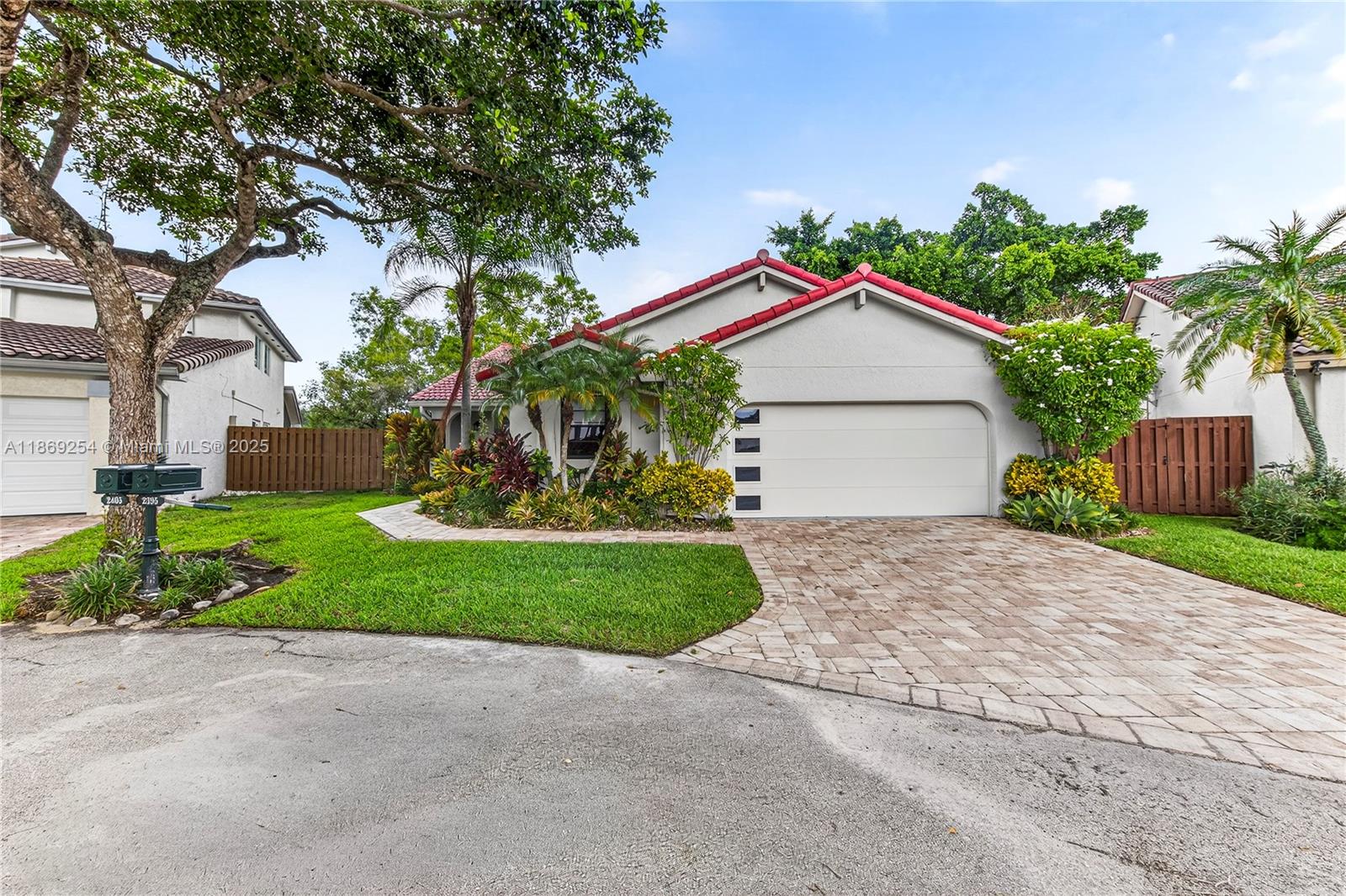 Welcome to this beautifully updated 3-bedroom, 2-bath home in the desirable Country Isles of Weston! This charming residence provides complete hurricane protection, featuring impact-resistant doors that ensure peace of mind. New A/C 2023. The designer kitchen features granite countertops, custom cabinetry, stainless steel appliances, designer light fixtures, and a family room off the kitchen. The home also features updated bathrooms and a primary organized walk-in closet, complete with designer custom—built—ins. Nestled on a corner lot in a quiet cul-de-sac, this home offers stunning water views and a serene setting. Just a short walk to schools and the community pool, with parks, recreation, major highways, FLL Airport, and beautiful beaches all within proximity.