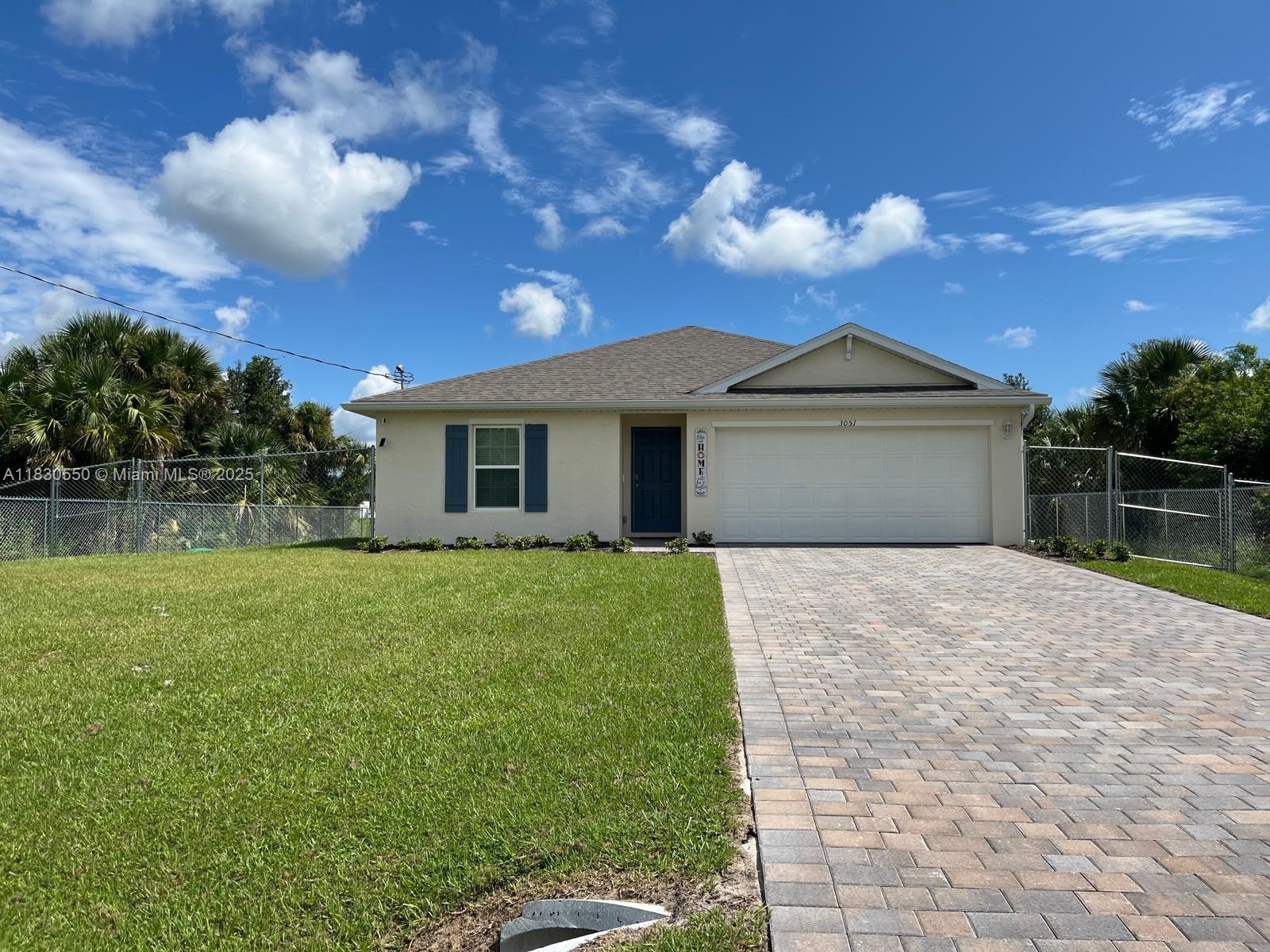 Brand-new 4 bedroom, 2 bathroom rental home in LaBelle, FL. This single-story property features an open layout with quartz countertops, stainless steel appliances, a large pantry, and wood-look tile flooring throughout. It comes with stainless steel appliances and dining table with chairs for added convenience. Located in a quiet residential area with no HOA, the home includes a 2-car attached garage and is pet-friendly with approval.