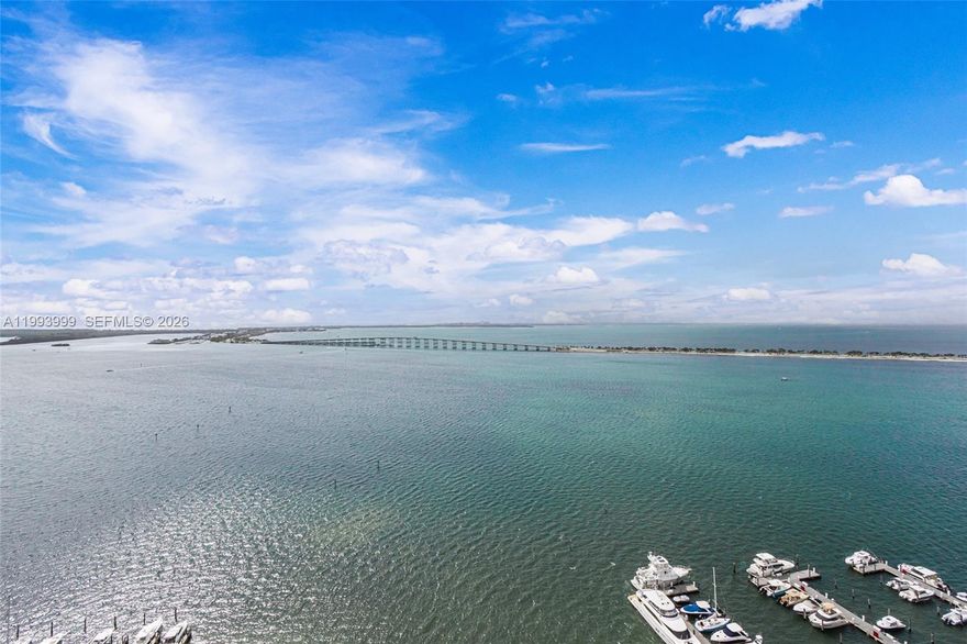 Completely remodeled East to West flow-through residence with 1,960 sqft and breathtaking direct Bay and City views. The expanded living area offers comfortable space for seating, dining, and entertaining.  Features an open contemporary kitchen with sleek countertops, ideal for both everyday living and hosting.  Located at the renowned and elegant Palace Condo in Brickell, in a quiet residential setting just steps from top restaurants, entertainment, Brickell City Centre, and the financial district.  Apt comes with 2 deeded parking spaces.