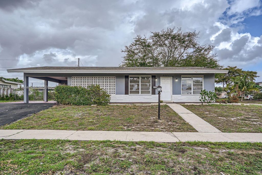 Photo of 4401 NW 6th Ct, Coconut Creek, FL 33066 (MLS # A11891619)