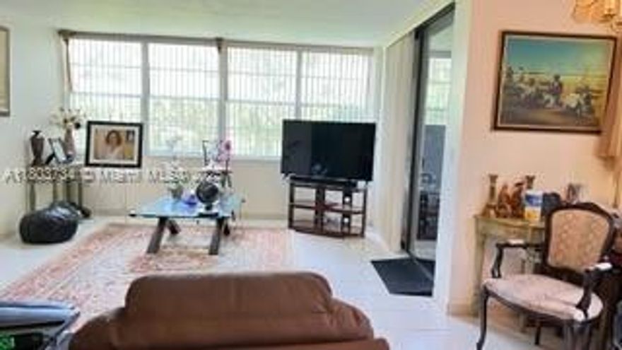 Don't miss this beautifully maintained ground floor corner unit located in the heart of Pembroke Pines in a desirable 55+ community. This spacious residence features a bright and airy living area with tile flooring throughout, a newer AC and water heater, and a generously sized master bedroom complete with a large walk-in closet. Relax on your private screened-in balcony and take in the stunning golf course views.  Enjoy resort-style living with community amenities including a guarded entry gate, sparkling pool, clubhouse, courtesy bus service, ample guest parking, and more. Centrally located with easy access to shopping, dining, and entertainment.  Schedule your showing today!