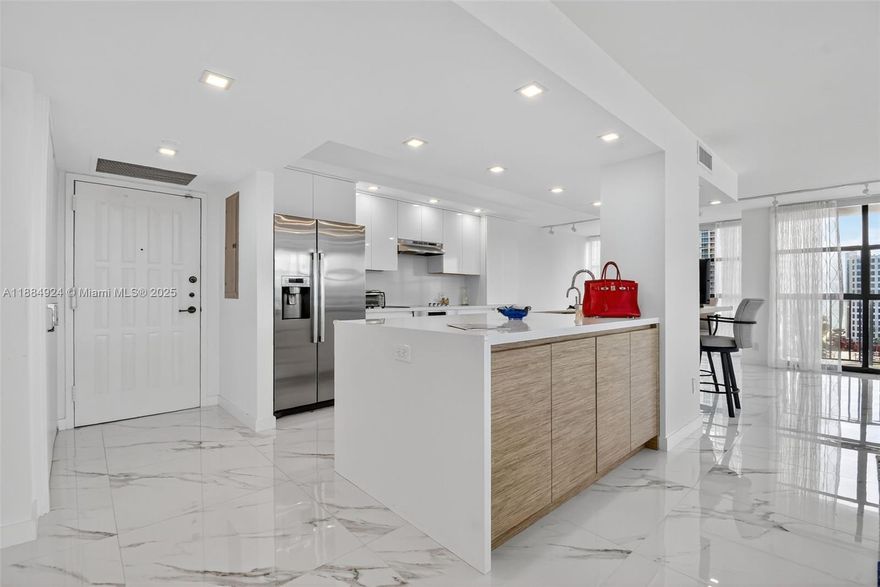 Wow! Completely Redone Spacious Modern Corner Unit w/ Intracoastal And Ocean Views Throughout! Light & Bright! View View View! Finest finishes include: White State of the Art Open Gourmet Kitchen with Bosch Appliances, New Floors, New Bathrooms, Washer Dryer In Unit, Custom Lighting, Custom Closets, Electric Shades Throughout, Floor to Ceiling Windows. A MUST SEE! 5 Star Amenities: 24 hour security, new gym, pool on intracoastal, BBQ area, sauna, tennis courts, and courtesy bus. Minutes to the beach, shopping, restaurants, Gulfstream Race Track & Casino, Diplomat Resort, Great schools, 2 International Airports.