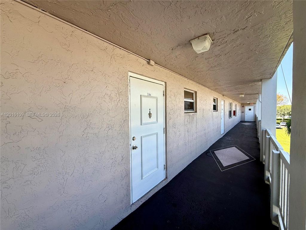 Photo of 1075 Riverside Dr #306, Coral Springs, FL 33071 (MLS # A12016109)