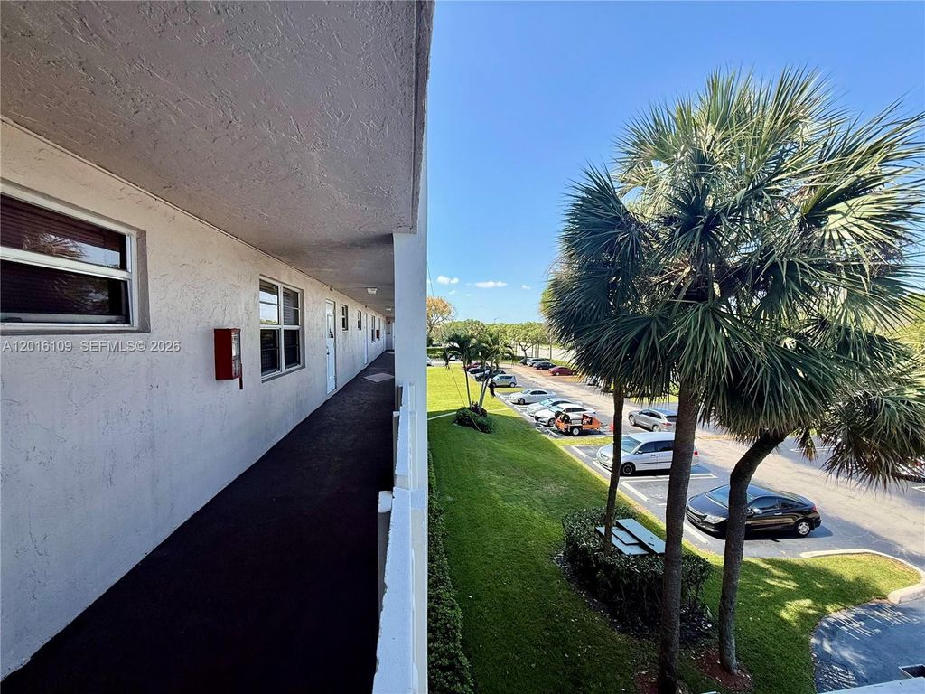 Photo of 1075 Riverside Dr #306, Coral Springs, FL 33071 (MLS # A12016109)