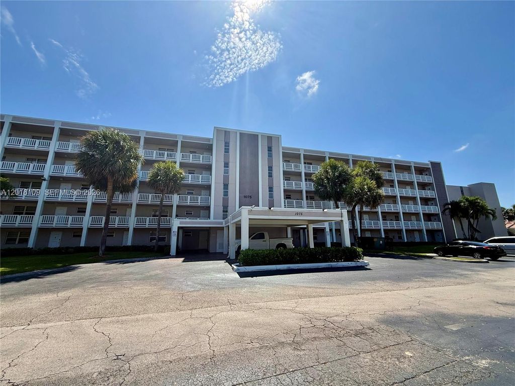 Photo of 1075 Riverside Dr #306, Coral Springs, FL 33071 (MLS # A12016109)