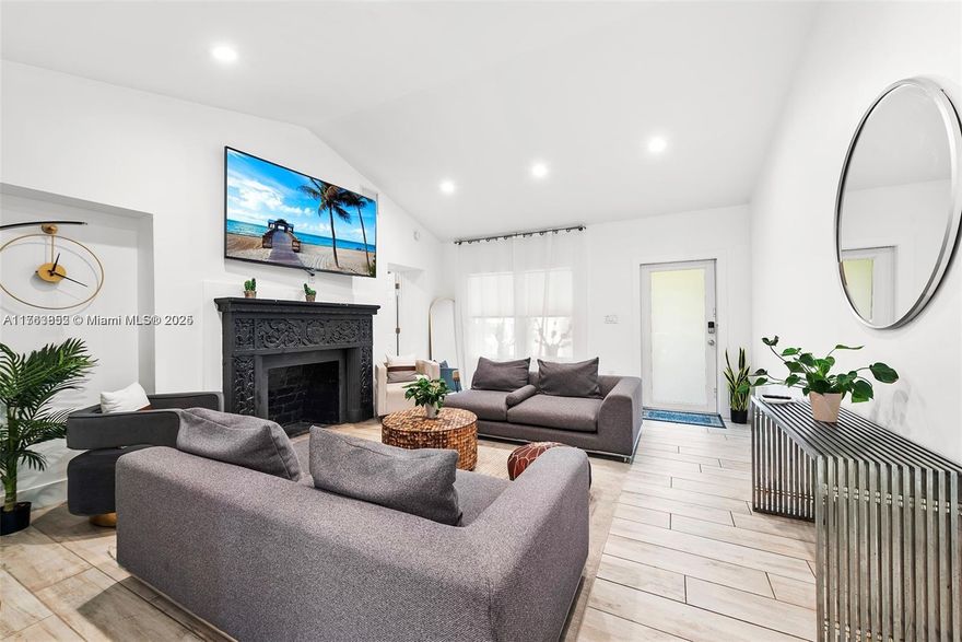 Currently used as a very profitable and popular Airbnb destination with over 50 5-star reviews and 6 months of advance bookings! Beautifully remodeled 5-bedroom, 4 bath home in the heart of one of Miami’s up-and-coming areas. No detail spared in the renovations. New plumbing, electrical, roofing, AC, pool motor. Original restored fireplace. High impact windows/doors. The home offers a split floor plan with a very spacious layout. Beautiful, landscaped backyard with heated infinity swimming pool and spa features. Centrally located with easy access to Miami Design District, Wynwood, Miami Beach and airports. Equipped with EV charger in 2 car driveway with motorized privacy gate.