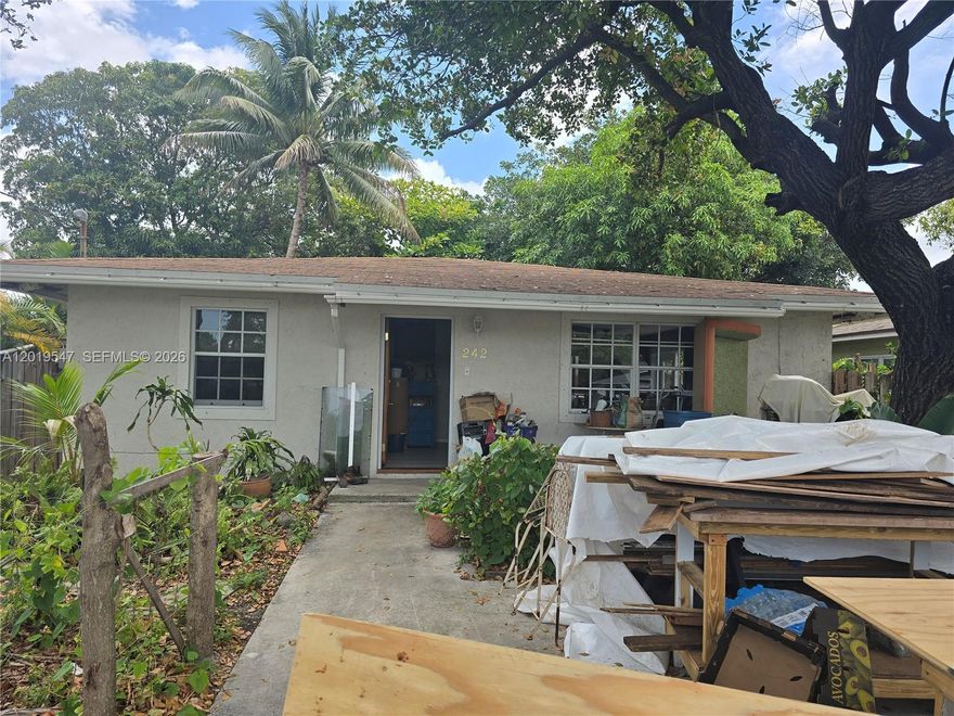 Charming Dania Beach home with great potential! This property offers a spacious backyard perfect for entertaining, gardening, or future outdoor additions.  A beautiful mature tree in the front yard provides abundant shade and helps keep the home cool year-round. Home is in need of a little TLC, making it a great opportunity for investors, first-time buyers, or anyone looking to add their personal touch.  Conveniently located near major highways, shopping, dining, beaches, and entertainment. Less than five minutes from Dania Pointe and the Ft. Lauderdale/Hollywood Airport