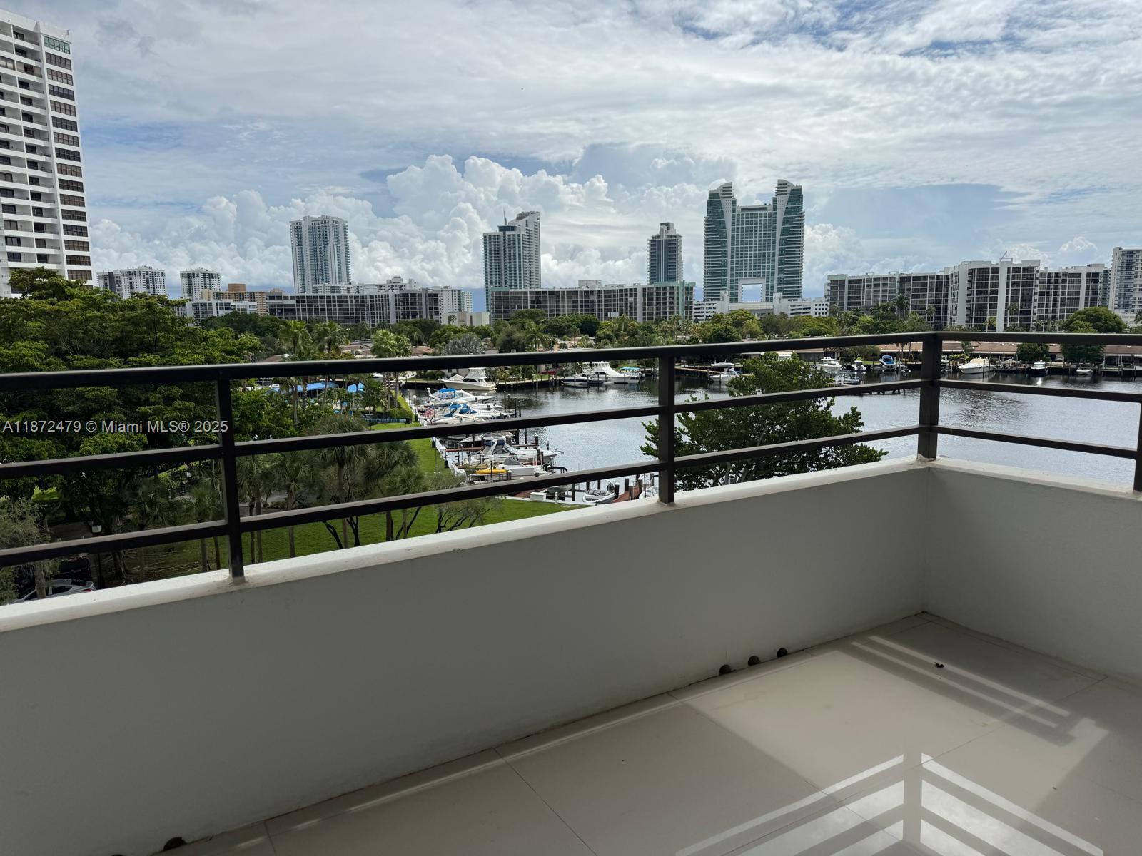 UNBELIEVABLE OPPORTUNITY! 2 bedroom, 2 bathroom condo in Olympos Towers & Marina. Updated unit features porcelain tile floors, granite countertops, and stainless steel appliances. Breathtaking bay and pool views. Amenities include 24-hour security, parking garage, valet service, storage and laundry on each floor. Enjoy 2 pools, conference room, BBQ area, and gym. Easy access to the beach. Don't miss out on this tropical paradise!"