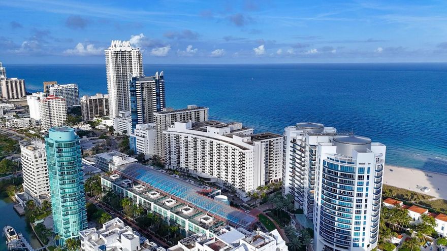 Wake up to the sound of waves in your private oceanfront oasis - 2 Bed/2 Bath Luxury Apartment! Indulge in your coastal haven with this exquisite fully furnished apartment boasting 1,290 SqFt of living space. Enjoy direct beach access from your own balcony. The apartment features abundant storage and an in-unit laundry room. Amenities include beach chairs and umbrella, parking, security, 4 BBQ areas, direct boardwalk access, on site grocery store and much more. Ideally situated near shops and dining options. Only a 15-minute drive from MIA Airport, South Beach, and Bal Harbour. Embrace the beach lifestyle at its finest!