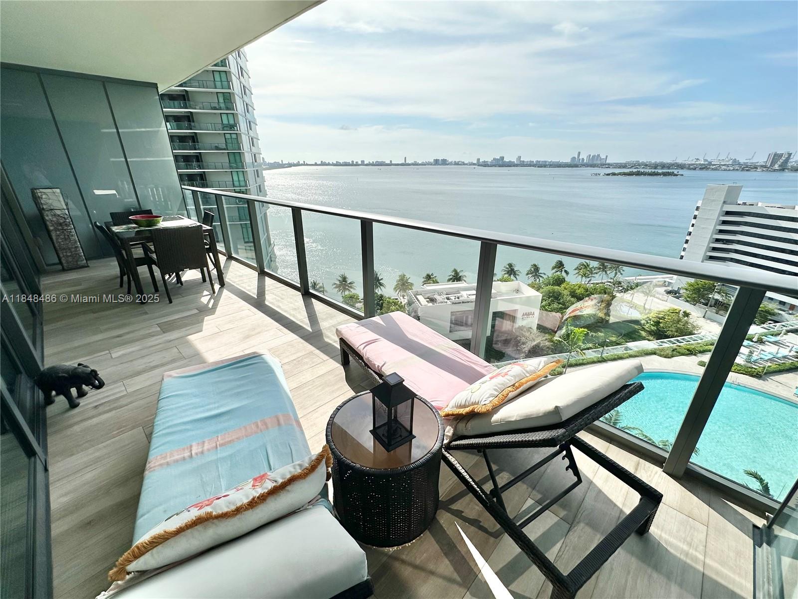 AVAILABLE SEPT. 14 2025. Spectacular furnished 2br/3bath unit with breathtaking bay and water views!! Step from your private elevator directly into your residence - no shared hallways!!
Outfitted with premium SubZero and Bosch appliances. Enjoy the ultimate in relaxation and recreation without ever leaving home; the paraiso complex offers a circular zero-entry heated pool, outdoor spa, poolside cabanas, summer kitchen, sun terrace, tennis center, bowling lanes, putting green, full-service spa with steam rooms, saunas and treatment rooms, movie theater, wine cellar, gaming rooms, party room, state of the art fitness center and much more. The Fabulous restaurant Amara by chef Michael Chwartz steps away from you. Building is minutes away from the design district, Wynwood & downtown.