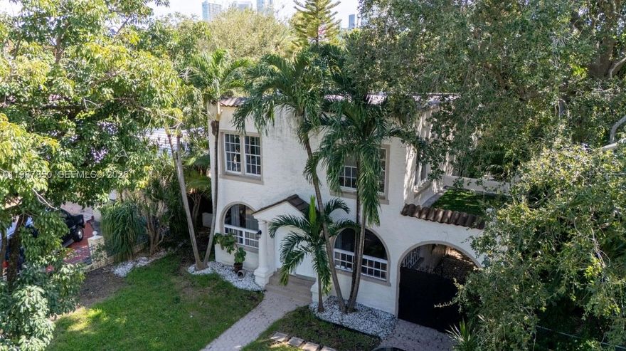 Located in the heart of the Miami Design District, this can be a two-story office property offers 8+  offices  or workspaces and 3.5 bathrooms, pool, blending historic charm with modern elegance. Expansive workspaces, refined finishes, a private motorized gate, and secure setting create an ideal environment for a creative studio, showroom. Enhanced by a pool perfect for post-work relaxation or hosting exclusive social events, just steps from luxury boutiques and fine dining.