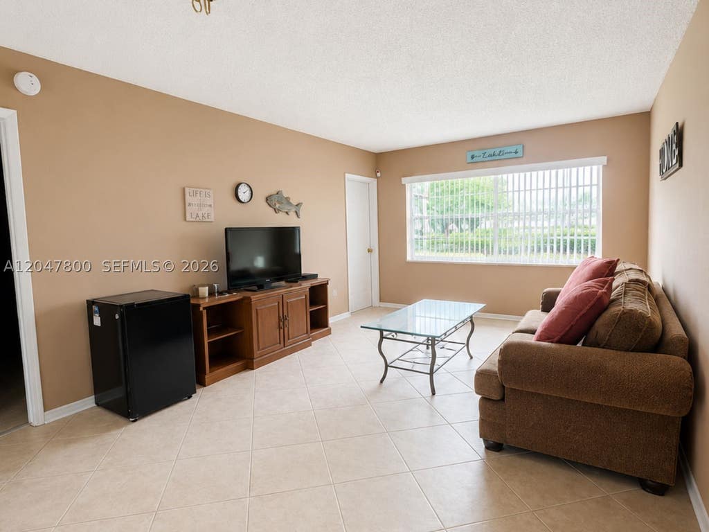 Photo of 4700 NW 35th St #411, Lauderdale Lakes, FL 33319 (MLS # A12047800)