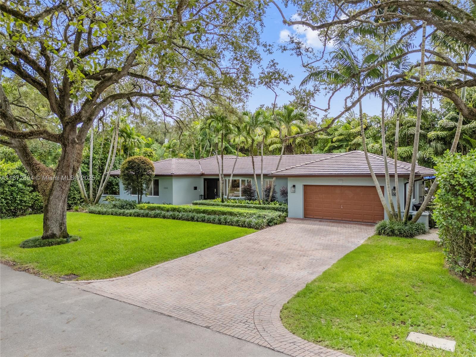 Completely renovated 4BR/4BA pool home on a 10,000 SF lot in the prestigious Coral Gables Country Club community. Features include a gourmet kitchen with Wolf appliances, indoor wet bar w/ dual wine coolers, Generac backup system, 2 new AC units, and a brand-new pool water heater. Spacious living areas flow seamlessly to the outdoor kitchen, pool, and patio shaded by tropical landscaping, ideal for entertaining. The two-car garage is equipped with Tesla chargers. Minutes from both the Biltmore Hotel & Riviera Country Club with golf membership options available. Rare opportunity to own on one of Coral Gable's most exclusive blocks.