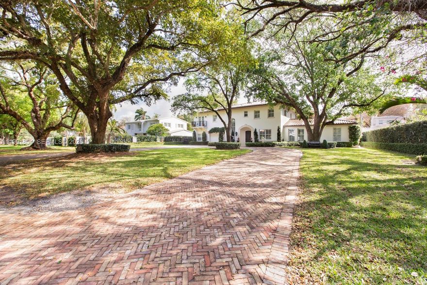 Perfectly positioned on a majestic, oak-lined lot along one of Coral Gables’ most prestigious and sought-after streets, this immaculate, fully renovated 5/4.5 residence truly has it all!
The 1st floor showcases elegantly appointed living spaces, including a formal living room w/ fireplace & marble floors, a refined dining room, a sun-drenched family room, and a private library featuring exquisite custom wood built-ins. The bright, professional-grade kitchen is ideal for entertaining, offering picturesque views of the impeccably manicured English-style topiary garden. Upstairs, a spacious landing leads to 4 generously sized bedrooms and 3 beautifully updated bathrooms. Outdoors, unwind in the screened patio or enjoy leisurely walks to the iconic Biltmore Hotel & the historic Venetian Pool.