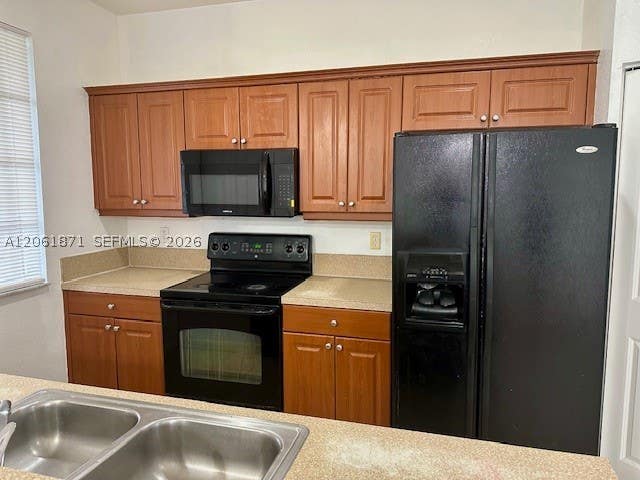 Photo of 1203 Abaco Ln, Riviera Beach, FL 33404 (MLS # A12061871)