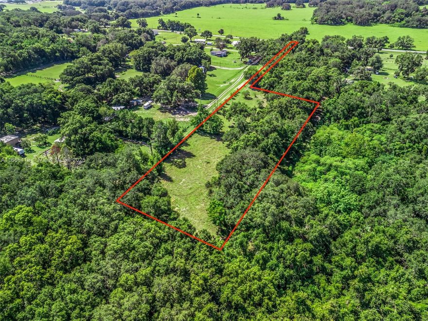 Welcome to 12751 SE Highway 42 in the heart of Weirsdale, Florida—an exceptional opportunity to own a piece of timeless Old Florida charm. Tucked down a private drive and shaded by majestic 100-year-old oaks, this tranquil property offers natural beauty, privacy, and endless possibilities. With well, septic, and electric in place, it’s ready for your vision—whether you're building a dream home, creating a multigenerational compound, or investing in future development. Eligible for a minor lot split, the land allows for multiple homesites and is conveniently located just minutes from the water. Properties with this much character, flexibility, and potential in such a peaceful setting are rare. A must-see for those seeking space, serenity, and opportunity in Marion County.