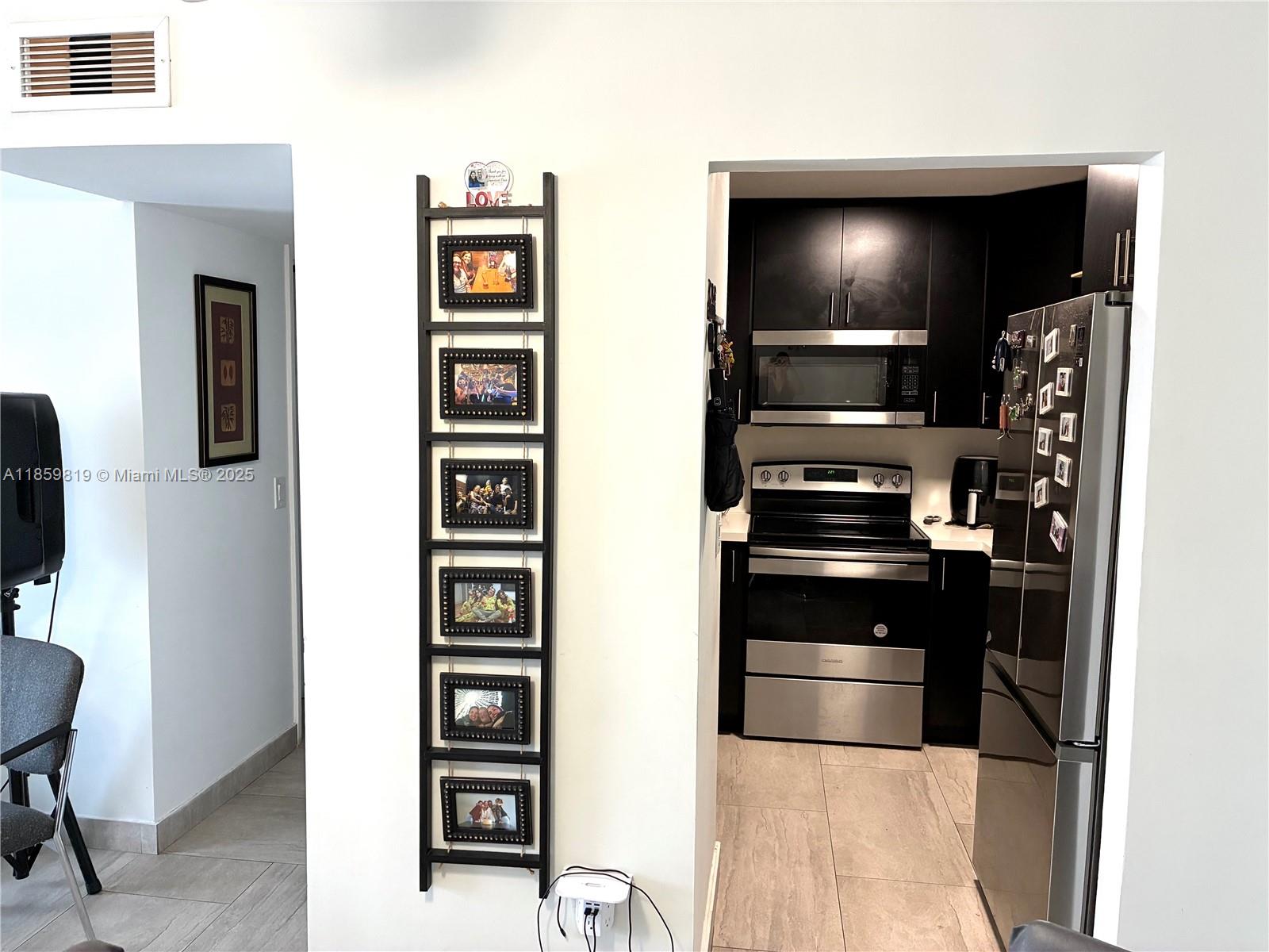 Fully remodeled! This 2-bedroom, 1.5-bath condo in the sought-after Madrid Terrace community blends modern style and comfort. Features include wood-look porcelain tile, open-concept living/dining, a gourmet kitchen with stainless steel appliances and quartz countertops, upgraded baths, remodeled closets, and elegant window treatments. Currently rented month-to-month at $2,100, with potential up to $2,400. Prime Miami location—an excellent investment opportunity!
