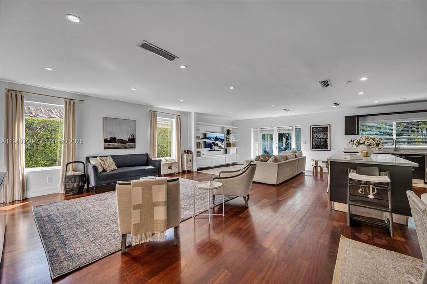 Beautifully renovated residence ideally located in the heart of Coral Gables. This home offers a seamless flow between the living, dining, family, and kitchen areas, creating a bright and inviting space perfect for both everyday living and entertaining. The open kitchen features sleek Italian cabinetry and a contemporary design. Notable upgrades include rich hardwood floors throughout, limestone-appointed bathrooms, impact casement windows, and impact-resistant French doors opening to a private courtyard patio. Additional improvements include custom built ins for storage, new plumbing, electrical, and A/C system. Tucked away on a quiet, tree canopied street, just minutes from the University of Miami, Coconut Grove, Downtown Brickell and all the dining options one could ask for!