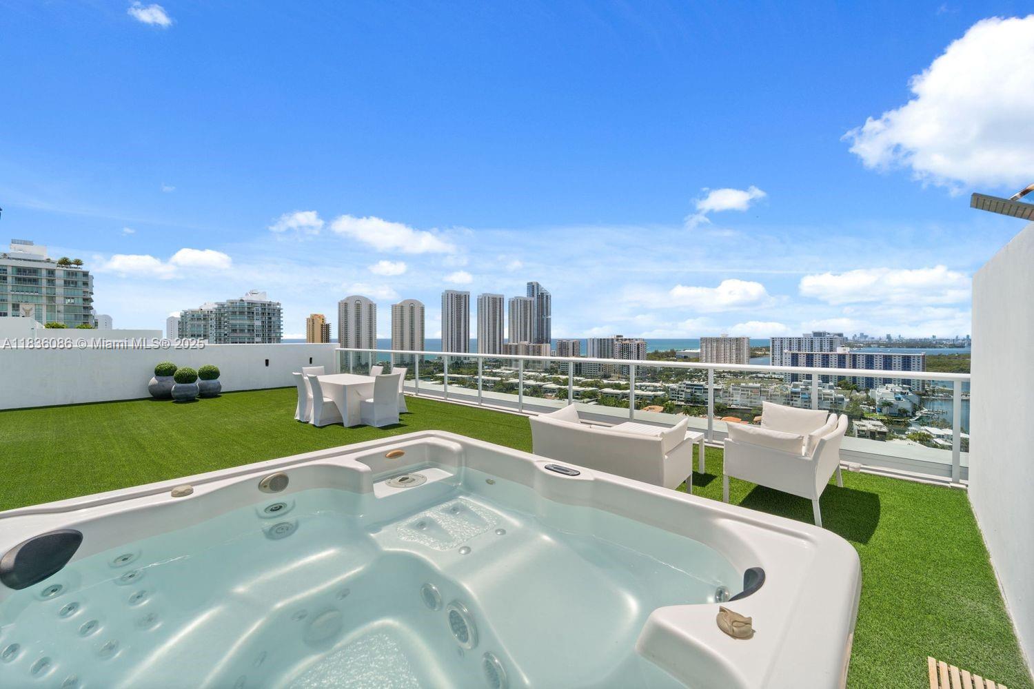 Welcome to the coveted Tower Suite at 400 Sunny Isles — penthouse living redefined. Flooded with natural light from its corner, flow-through layout, this residence offers endless potential for both daily living and entertaining. Spanning the length of the building, it features 20-foot ceilings, walls of glass, and sleek modern interiors. With 4 spacious bedrooms and 4.5 spa-inspired baths, the showstopper is the 1,400 sq ft private rooftop terrace — your personal sky lounge with unobstructed views from ocean to skyline. The community offers an Olympic-size pool, state-of-the-art gym, tennis and pickleball courts, full-service marina, and waterfront dining. Just a short stroll to the beach and minutes from Bal Harbour, Aventura, and both Miami and Fort Lauderdale airports.