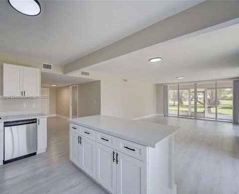 Photo of 7582 NW 86th Ter #104, Tamarac, FL 33321 (MLS # A11972583)