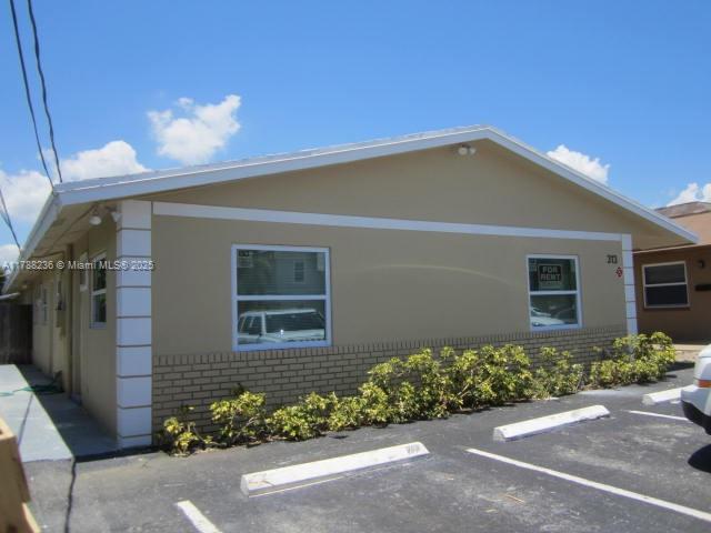 Investor's dream. 4 units each 1bed 1 bath. Fully rented to excellent tenants, yearly leases with Security Deposits. tenants pay for electric and internet. New high impact windows. Washer Dryer lease. 4 tandem parking spaces. Gross rent $74,700 yr. Owner's expenses: water $3840, lawn $600, real estate taxes 2024 $10955.52. Located a few blocks away from the prestigious KOI Residences and Marina, a mere 1.6 miles from the beach, close proximity to parks, golf courses, shopping, dining and entertainment. Tons of recent and up and coming redevelopments in the area. Please do not disturb tenants.