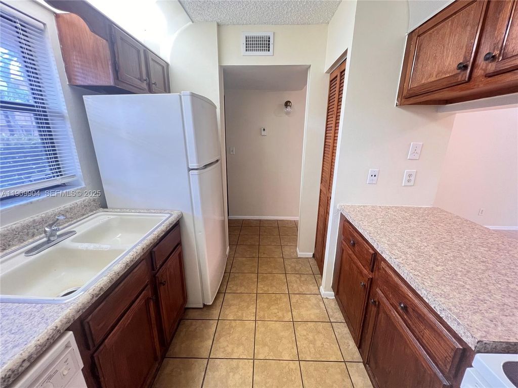 Photo of 11441 NW 39th Ct #117-3, Coral Springs, FL 33065 (MLS # A11909904)