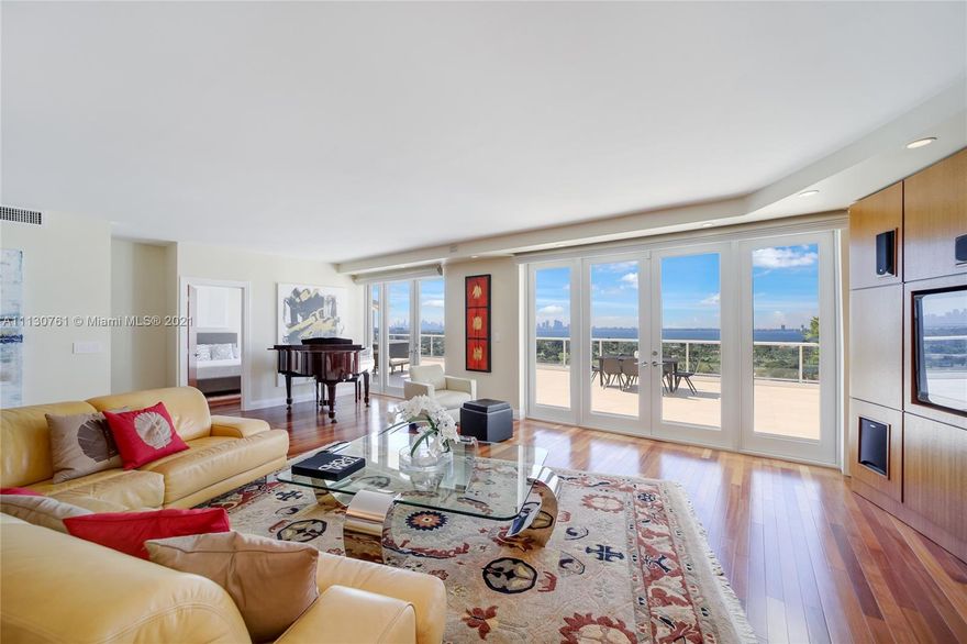 LUXURY 2 BEDROOMS, 2 FULL BATHROOMS PENTHOUSE. 2,100 SQUARE FEET UNDER AIR CONDITIONING & AN ADDITIONAL 1,200 SQUARE FEET OF TERRACE W/ GORGEOUS VIEWS OF THE INTRA-COASTAL, BISCAYNE BAY, LA GORCE GOLF COURSE, & DOWNTOWN MIAMI AND THE SUNSET. AMAZING JACUZZI ON TERRACE. THIS UNIQUE PENTHOUSE INCLUDES A POOL-SIDE CABANA W/FULL BATH. THE RESIDENCE IS FULLY FURNISHED, FEATURING ITALIAN SNAIDERO CHERRY WOOD KITCHEN CABINETRY, MIELE APPLIANCE & CUSTOM MADE FURNITURE. CHERRY WOOD FLOORS. MARBLE BATHROOMS. STEAM ROOM AND JACUZZI IN MASTER BATH.LAUNDRY ROOM. PRIVATE STORAGE ON THE APARTMENT FLOOR. PRIVATE WINE CELLAR. 2 PARKING SPACES ASSIGNED. BUILDING COMPLETELY RENOVATED WITH NEW GYM, POOL AREA, ELEVATORS, LOBBY, HEATED POOL, RESTAURANT, MASSAGE ROOM,.BUILDING HAS PRIVATE MARINA. BOATERS DREAM.