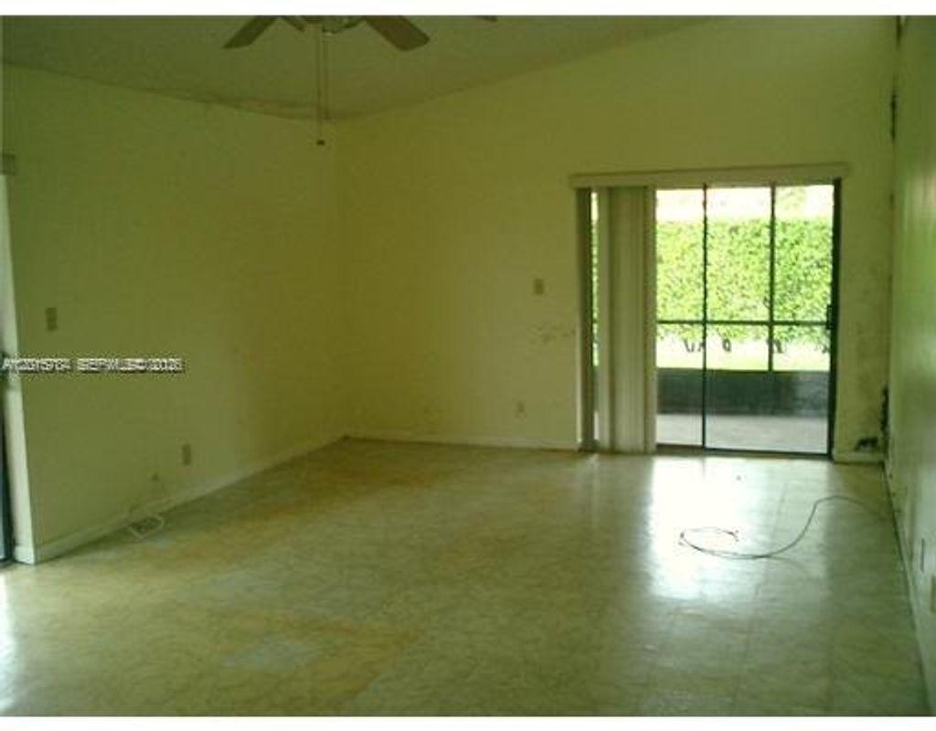 Photo of 5702 Swordfish Cir, Tamarac, FL 33319 (MLS # A12015784)