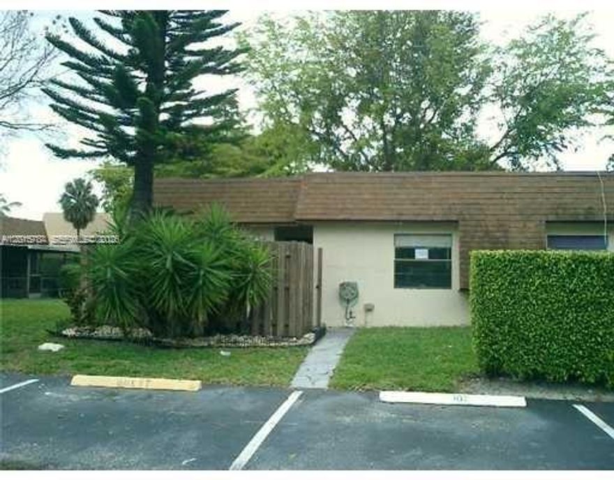 One story townhouse, with a fenced front yard and wraparound porch in the rear. Corner unit with no lateral neighbor. All tile floors, washer dryer inside, water included, own parking spot in front of unit, plenty of guest parking. Rented to a good section 8 tenant of many years, on month-to-month basis, tenant prefers to stay.