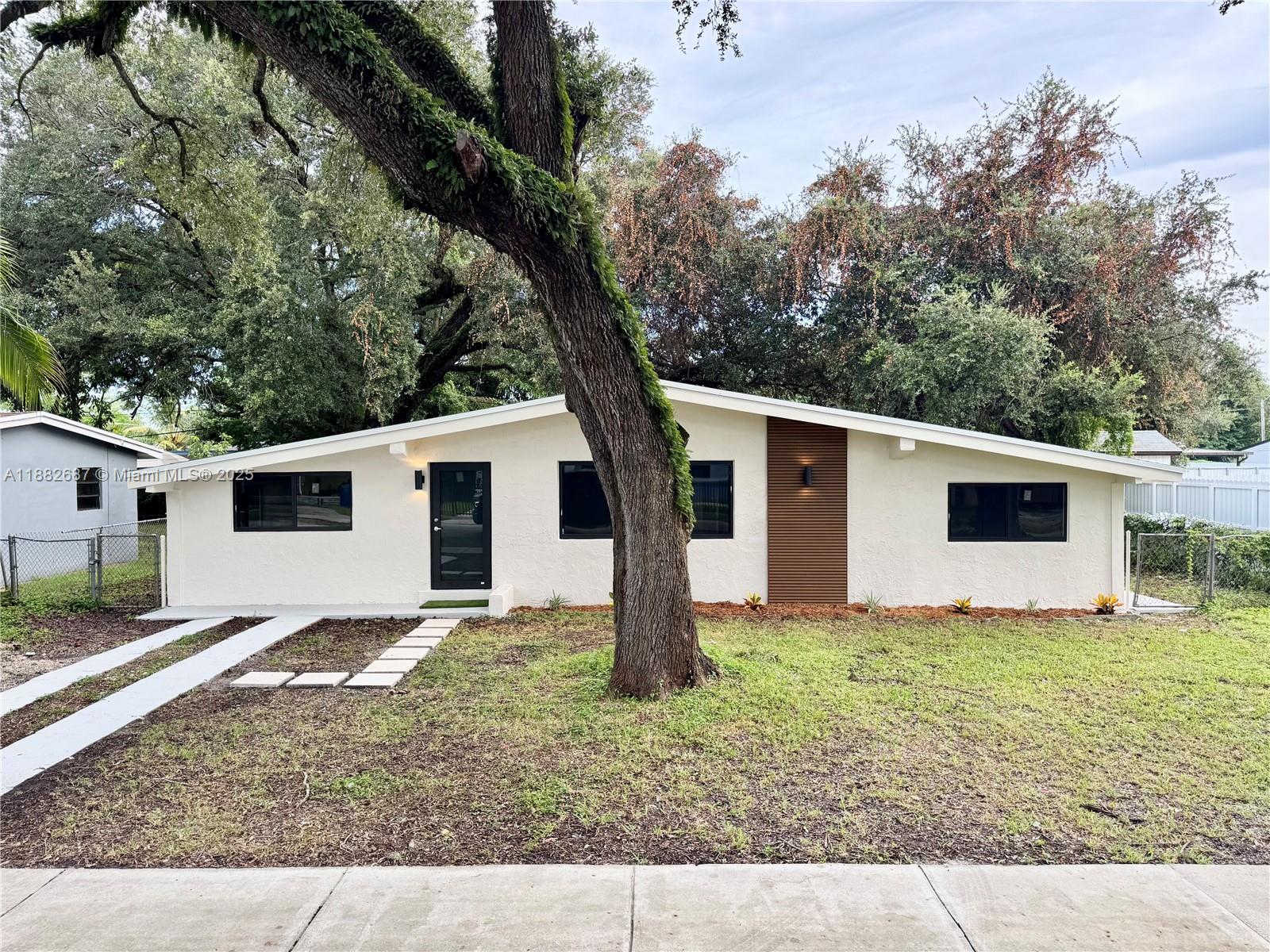 Completely remodeled 4-bedroom, 2-bath home in the heart of Miami Gardens! This move-in ready gem features a brand new roof, full impact windows/doors, a modern kitchen with quartz countertops, and stylishly updated bathrooms. Larger than tax roll (1,243 sq/ft living). The spacious layout includes a versatile 4th bedroom currently used as a den, easily convertible back to a bedroom. Enjoy peace of mind, comfort, and style all in one. Conveniently located near schools, shopping, and major highways. Don’t miss this incredible opportunity!