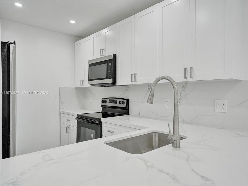 Photo of 10051 Winding Lake Rd #201, Sunrise, FL 33351 (MLS # A11975924)