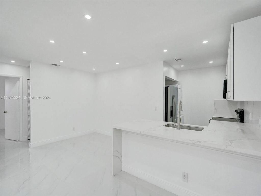 Photo of 10051 Winding Lake Rd #201, Sunrise, FL 33351 (MLS # A11975924)