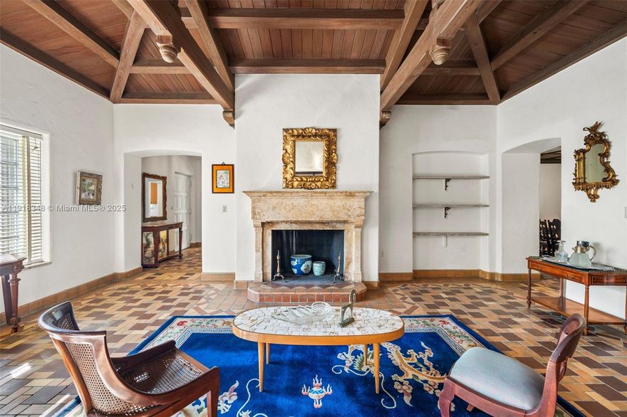 Prime Location, Endless Potential! An exceptional opportunity to own in one of Miami Beach's most prestigious residential neighborhoods. Set on an expansive nearly 10,000 SF lot, this classic Mediterranean home blends timeless architecture with the warmth and charm that define this historic enclave. Inside, the home features 4 bedrooms and 4 baths, plus an air-conditioned converted garage that can serve as an optional 5th bedroom or flexible multi-purpose space. The main level includes a bright Florida room with a fireplace, a spacious living room, den, and a primary suite with ensuite bath. Upstairs, two large ensuite bedrooms offer abundant natural light, including one with its own private balcony. The backyard provides generous room for entertaining and ample space to add a pool—your future private oasis. Original architectural details including wood-beamed ceilings, decorative Spanish tile, mahogany flooring on the second level, and cedar-lined closets bring authenticity and timeless character throughout. Surrounded by lush canopies and quiet, tree-lined streets, the location offers the ultimate Miami Beach lifestyle—just moments from world-class dining, boutique shopping, top-rated schools, cultural venues, houses of worship, and the beach. You’re also minutes from 41st Street’s conveniences and the iconic Faena Hotel, placing the best of Miami Beach at your doorstep.