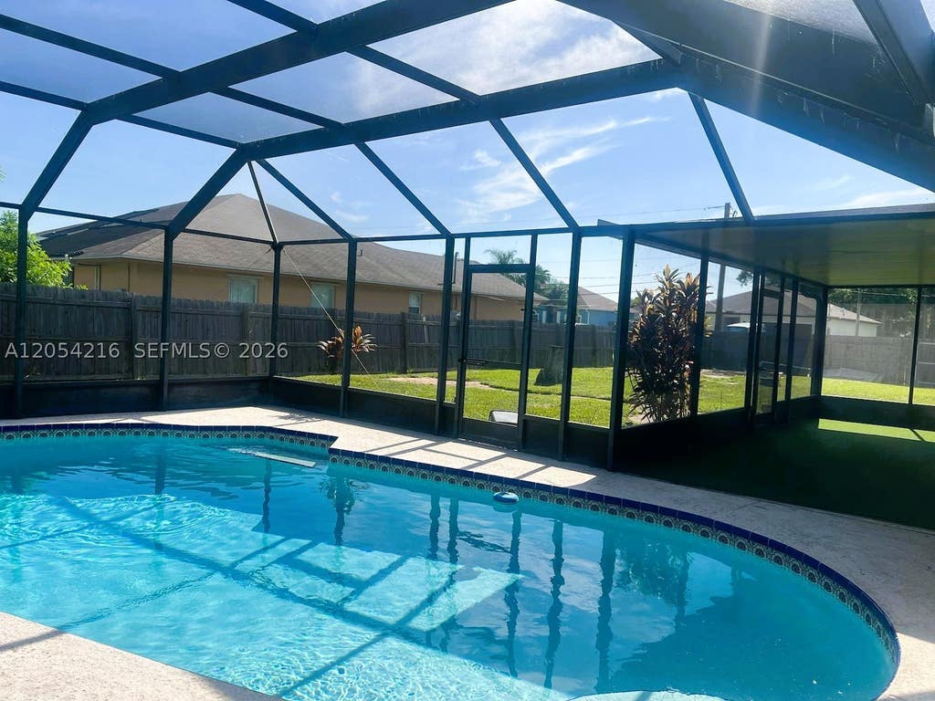 Photo of 1573 SW Lexington Dr, Port St Lucie, FL 34953 (MLS # A12054216)