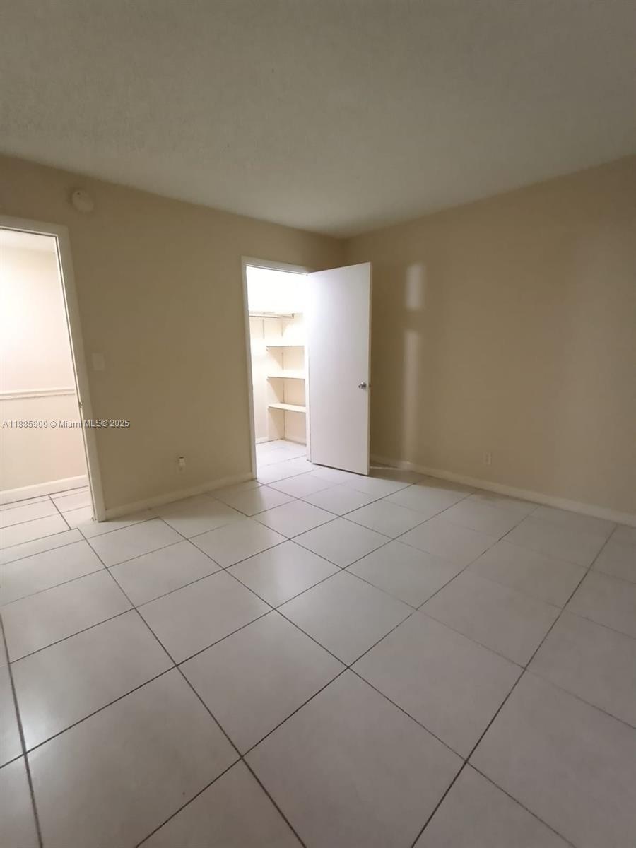 Spacious 2-bed 2-bath corner condo, gated community in the heart of Plantation. Washer and dryer inside the unit. Large screened patio overlooking the canal. Cozy breakfast nook, ceramic flooring throughout. One parking spot, ample guest parking. Amenities include great pool, clubhouse, gym, sauna, tennis court. Pet friendly, under 30 lbs. Centrally located, close to highways, Ikea, Sawgrass Mills Mall. NOTE: To visit this unit, please, park outside of the gate, where it stated guest parking. You will see a sidewalk on the side of the clubhouse, leading you towards the inside of the property. Look for building 430, which is the middle building.