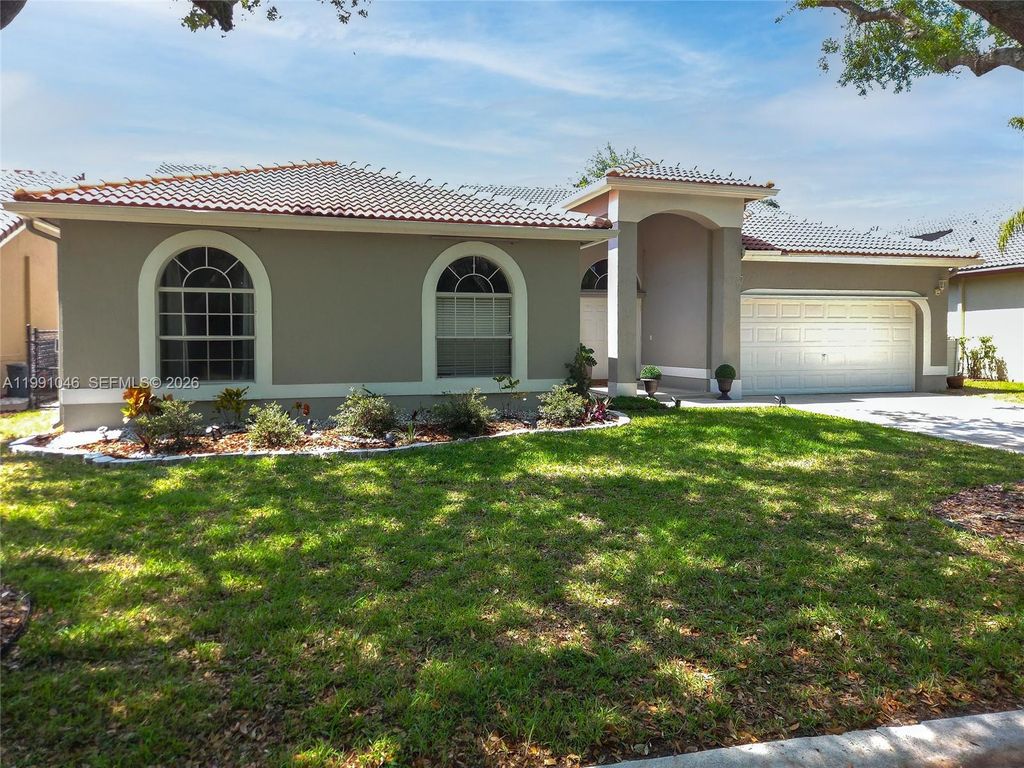 Photo of 5318 NW 57th Ave, Coral Springs, FL 33067 (MLS # A11991046)