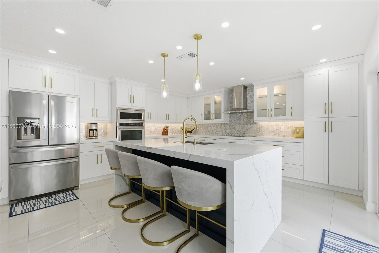 A rare and stunning, fully renovated townhouse in The Hammocks, West Kendall. This spacious 1,790 sq. ft. home offers five bedrooms, with the fifth created from a converted garage featuring a kitchenette and laundry area. Enjoy two elegant full baths and a guest bath, all with modern finishes. Every detail was reimagined with new flooring, a designer kitchen, and stylish fixtures throughout. Hurricane impact windows and doors provide peace of mind, complemented by a new roof and an HOA that covers the exterior and roof for lower insurance costs. The community maintains strong reserves, qualifies for 3% down financing, and offers resort-style amenities with lakefront trails, pools, tennis courts, lush parks, and nearby Publix and The Hammocks Town Center, just a 4-minute drive away.