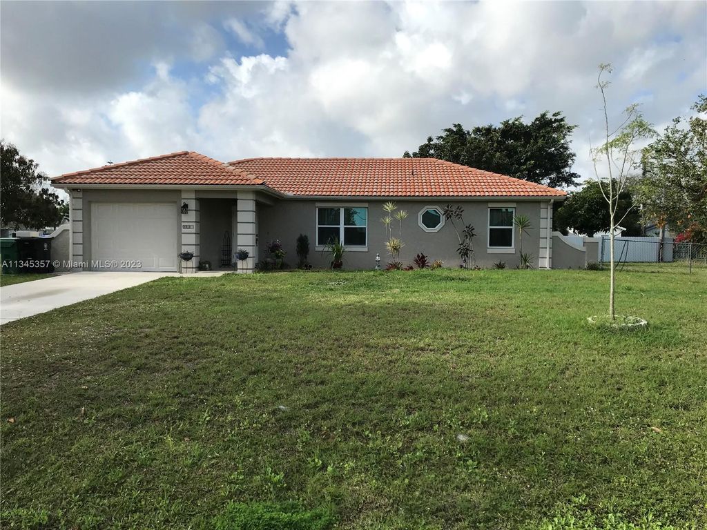 Photo of 265 SW Dalton Cir, Port Saint Lucie, FL 34953 (MLS # A11345357)