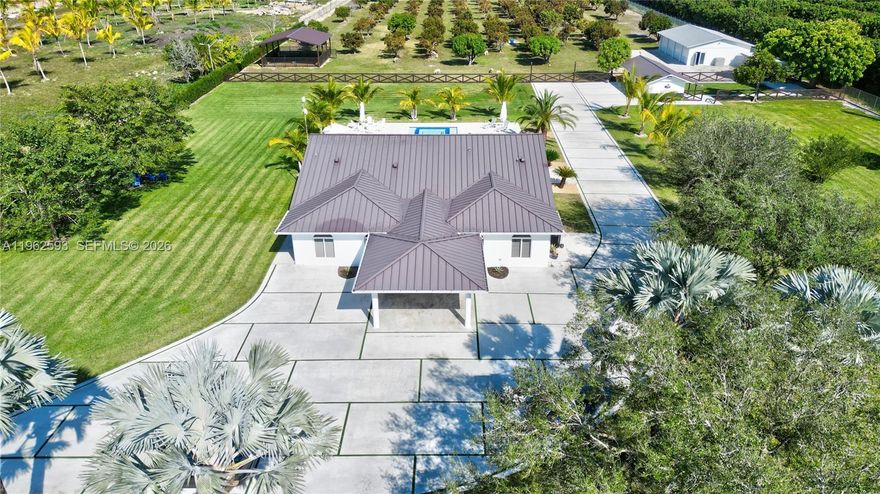 Welcome to Paradise!! This 4.79 lot (208,652 sq/ft) consists of a main house, guest house, 40x30 salt water pool with whirlpool, surrounded by fruit trees, palm trees and an unbelievable outdoor entertainment area for all of your friends and family. The entire property was renovated inside and out with a blend of luxury and countryside living. Property features 5 Bedrooms and 4 bathrooms that includes a separate 1 bedroom and 1 bathroom guest house. Entire property has hurricane impact windows. A must see dream property!!