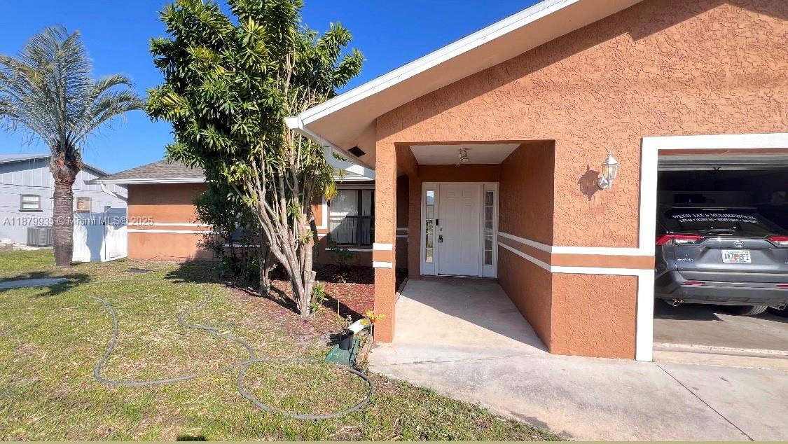 Welcome to this charming 3-bed, 2-bath home in the heart of Port St. Lucie, offering comfort, space, and convenience. Boasting approximately 1,858 sq. ft. of living space, this well-maintained home features an open floor plan with a spacious kitchen flowing seamlessly into the living and dining areas—perfect for entertaining. The generously sized bedrooms provide ample closet space, while tile flooring in the main areas ensures durability. The property also offers a screened porch and plenty of outdoor space for relaxation! Conveniently located near top-rated schools, parks, shopping, and dining, this home is an ideal choice for families or professionals seeking a blend of comfort and accessibility. Roof was replace in 2025. Don’t miss this opportunity!