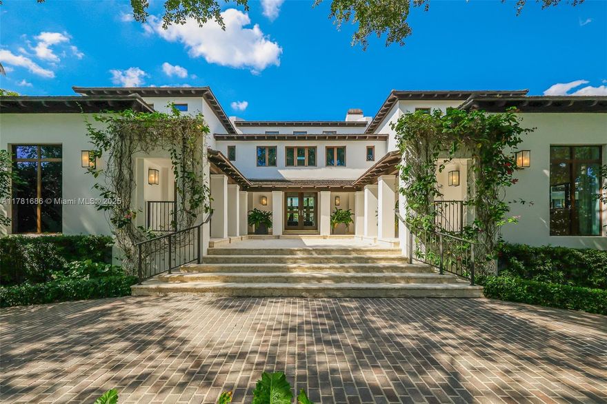 Experience unparalleled luxury at 555 Arvida Parkway, a stunning Mediterranean estate in exclusive Gables Estates. This 6-bed, 6/2 bath residence offers 13,147 SF of refined living space on over an acre with 180 ft of waterfront and a 100-ft dock, granting direct ocean access and resort-style living. Enter through a grand foyer with soaring ceilings into elegant, light-filled spaces designed for both lavish entertaining and intimate gatherings. Indulge in a chef’s kitchen with top-tier appliances, a 5,000-bottle wine cellar, and a stunning saltwater aquarium. Outdoors features a swimming pool, summer kitchen, and lush grounds. There’s potential to increase the bedroom count, per floorplan. One of only 24 homes with access to community tennis courts. A rare masterpiece of waterfront luxury.