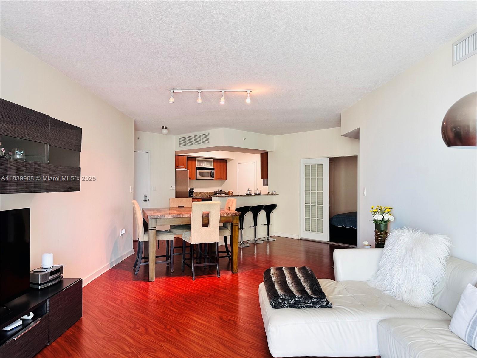 Experience elevated living in this amazing 2BED/2BA PLUS DEN residence at Metropolis at Dadeland. This well-appointed unit features an open-concept layout, modern and spacious kitchen with granite countertops and stainless steel appliances, large bedrooms, walk-in closets, in-unit washer/dryer, and a versatile den perfect for a home office or guest space (it is basically a 3rd Bedroom). Enjoy premier amenities including two pools, jacuzzi, full fitness center, sauna, resident lounge, 24-hour concierge, valet parking, and security. Ideally located just steps from Dadeland Mall, Metrorail, Supermarkets, and top dining. One assigned parking space included. Pet-friendly and investor-friendly—urban living at its best!!