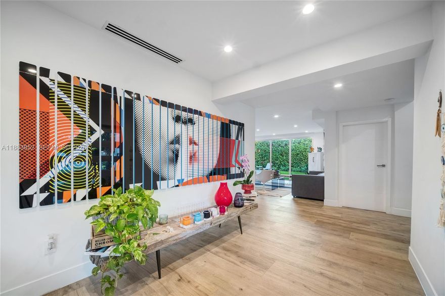 Nestled beneath the lush tree canopy of North Coconut Grove’s exclusive Bay Heights, this renovated smart home blends privacy, warmth, and effortless indoor-outdoor living—ideal for a growing family seeking comfort and functionality.

Designed for both entertaining and everyday family life, the home features bright open social spaces, an open-concept kitchen and family room, a private studio/home office, and a terrace overlooking the pool. With 4 spacious bedrooms, each with its own private bathroom, the layout offers comfort, independence, and convenience for every member of the family. Quiet tree-lined streets and mature landscaping create a true retreat just minutes from Brickell, Coral Gables, Downtown Miami, marinas, parks, and top-rated schools.
Fully renovated in 2018 with integrated smart-home technology controlling lighting, shades, irrigation, and AC systems.