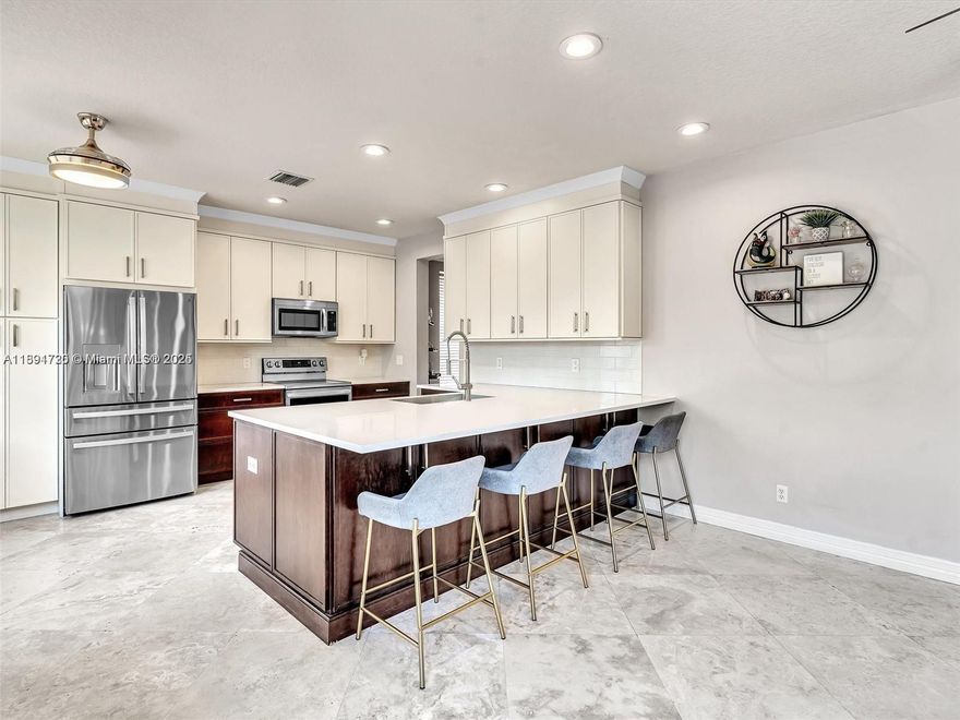 LIVE THE WESTON LIFESTYLE! Experience luxury living in this spectacular cul-de-sac pool home located in one of Weston’s most desirable communities—zoned for all A-rated schools! This fully remodeled residence blends elegance & comfort with Brazilian hardwood and travertine floors, a chef’s kitchen featuring quartz countertops, designer cabinetry & premium finishes. Upstairs offers 5 spacious bedrooms + a versatile loft ideal for a home office or gym. Relax or entertain in your private backyard oasis with pool & fenced yard. Upgrades include 2022 AC, 2020 water heater, accordion shutters, insulated garage & whole-house water system. Style, comfort & location—this home has it all!