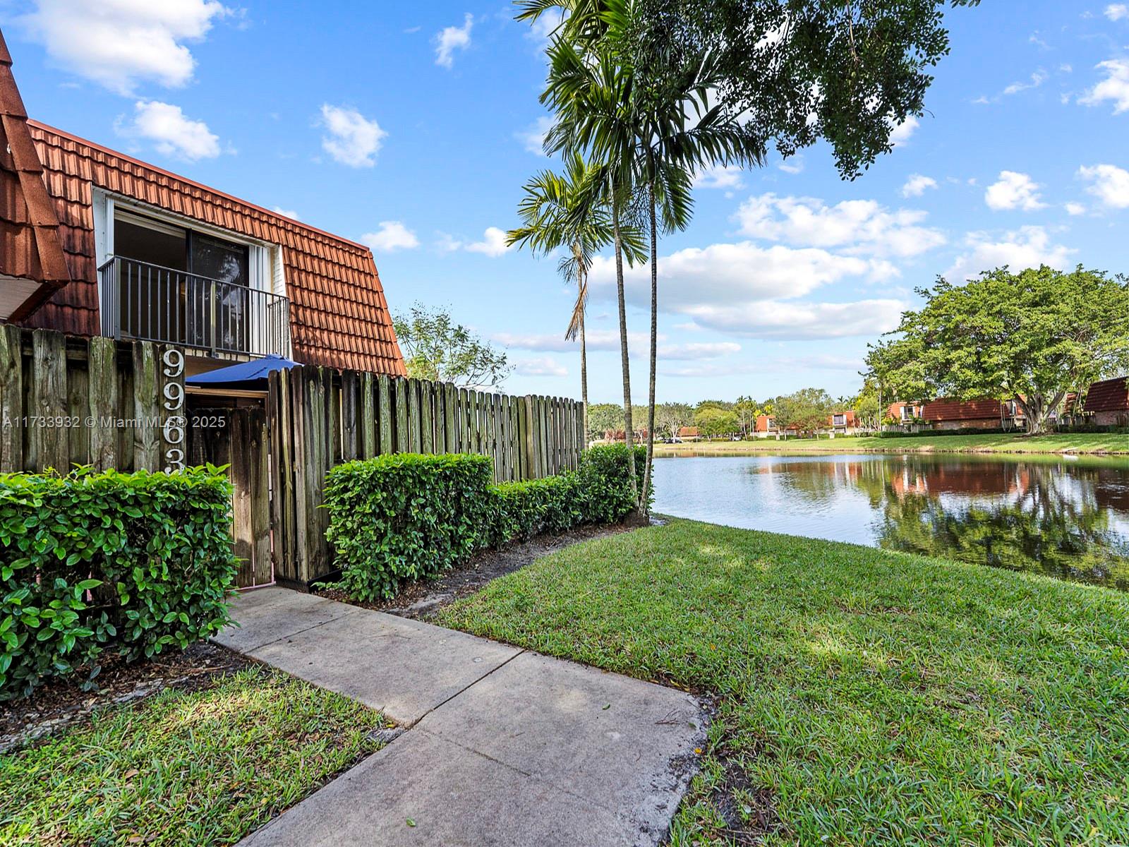 Beautifully updated corner townhome on the lake; with fenced patio. Spacious 2 bedroom/2.5 bathrooms. Home was fully updated between 2020 and 2023 with new laminate flooring, wood kitchen cabinets, corian tops, stainless steel appliances. Bathrooms were also renovated with glass top vanities and tile shower area. Accordion shutters thru home. Home is currently leased until the first week of June. Fantastic Tenant that can either stay or can vacate. Please call listing broker for more info.
