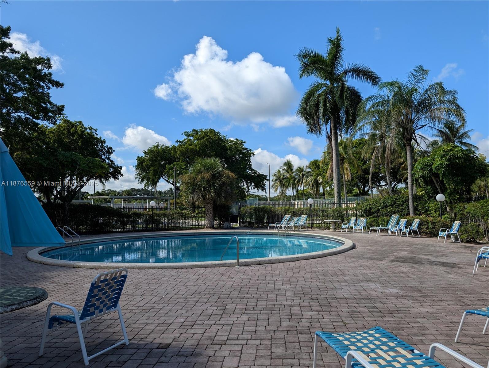 Enjoy easy 55+ living in the desirable Water Bridge community in the heart of Sunrise. This sun-filled 2BR/2BA, 1,090 SF top-floor home (elevator building) features HURRICANE-IMPACT WINDOWS & DOORS for peace of mind, quiet, and energy efficiency. A bright great room opens to a private screened balcony—perfect for morning coffee. Split bedrooms for privacy; the spacious primary suite offers a huge walk-in closet and en-suite bath. Practical kitchen, excellent storage, laundry on the floor, and assigned parking. Community amenities include a clubhouse, pool, library, BBQ area, shuffleboard, and elevators. Low HOA fee includes water and common-area maintenance. Prime location close to shopping, dining, and major highways. Easy to show—schedule your tour today!