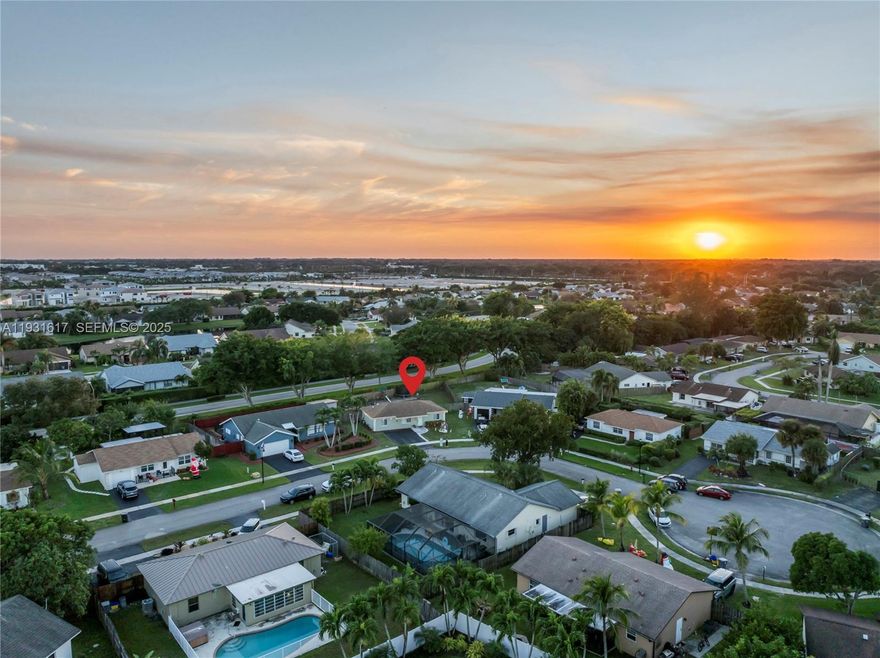 Set on a quiet cul-de-sac in Southwind Lakes / American Homes, 9612 Wyoming Ct offers open-concept living on an oversized lot—perfect for outdoor entertaining, play, pets, or future plans. Major improvements include Cat 5-rated impact windows, a newer roof, whole-home water filtration, a tankless water heater, smart thermostat, LED lighting, and upgraded plugs, switches, and fixtures.

The kitchen features quartz countertops, a stylish backsplash, refreshed cabinetry/doors, an upgraded sink and faucet, plus stainless appliances. Laundry is upgraded with a smart washer and dryer, plus a newer dishwasher. An EV plug adds modern convenience.

Outside, enjoy fresh exterior paint, refreshed landscaping, outdoor lighting, and a patio seating area. Community amenities include a kids playground, two tennis courts, two basketball courts, and a new pool—close to shopping, dining, and everyday Boca conveniences.

Southwinds golf course is just steps away.
