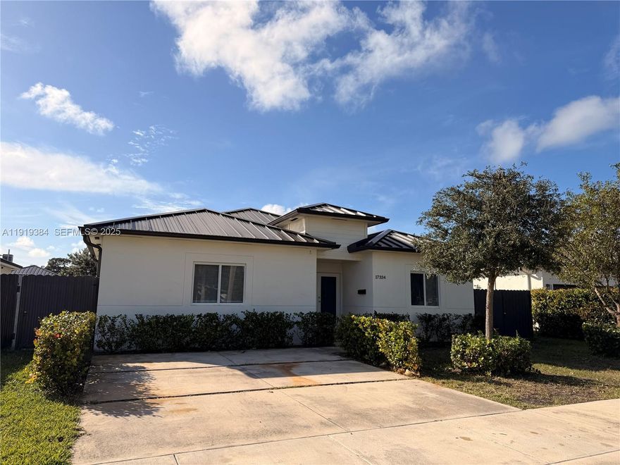 For sale in the heart of Homestead — spacious single-family home with no HOA, featuring a 4-bedroom, 2-bath main home plus a 1-bedroom, 1-bath in-law suite with a private side entrance, perfect for extended family or guests. This beautifully finished residence offers an open-concept floor plan with high ceilings, large modern tiles throughout, a wrap-around kitchen overlooking the private fenced backyard, elegant bathrooms with floating vanities and lighted mirrors, a full-size laundry room, and impact windows and doors for peace of mind