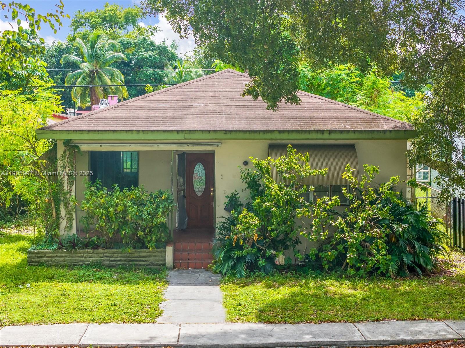 Discover the potential of this charming Miami home! On tax roll as a 2 bed / 1 bath, currently set up as a 3/1. The detached garage includes a full bath, perfect for storage, workspace, or creative use. An excellent canvas to renovate and make your own. Property is situated on a 5,000 SF lot and a central location just minutes from Wynwood, Design District, Midtown, and major highways. Sold AS-IS, bring your vision and unlock the value!