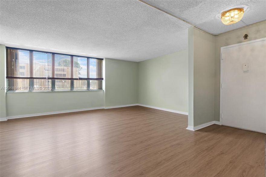 Feels like a single-family home with 1,700 sq. ft. and an intentional, well-designed layout. This spacious 3-bedroom, 2-bath ground-floor condo offers comfort and functionality throughout. Features include an updated kitchen and bathrooms, new A/C system, and new flooring. The enclosed balcony adds valuable extra living space, ideal for a den, office, or play area.  The unit includes two assigned parking spaces along with ample guest parking. Conveniently located directly across from the community pool, playground, and clubroom.  Situated in a desirable Kendall neighborhood with access to A-rated elementary, middle, and high schools. Property presents an excellent opportunity for a buyer to add personal touches.